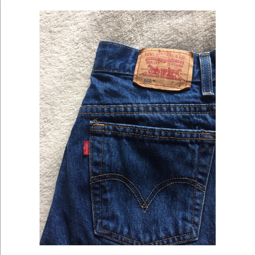 Dark washed Levis 550 jeans.